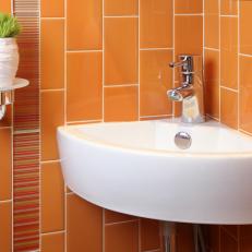 Corner Sink in Orange Tiled Bathroom
