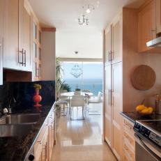Modern Galley Kitchen With Natural Wood Cabinetry