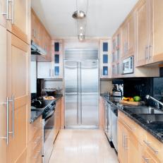 Modern Galley Kitchen With Natural Wood Cabinetry