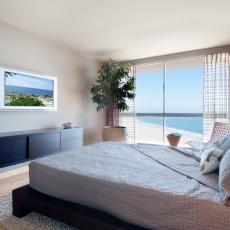 Neutral Ocean-Front Master Bedroom With Custom Wall Console