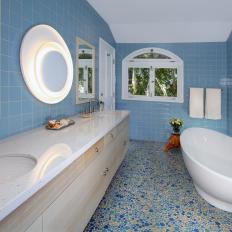 Stunning Blue Tiled Bathroom With Oval Soaking Tub