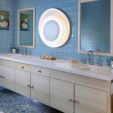 Blue Tiled Bathroom With Light Wood Floating Vanity