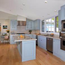 Stylish Open Plan Kitchen With Light Blue Cabinetry