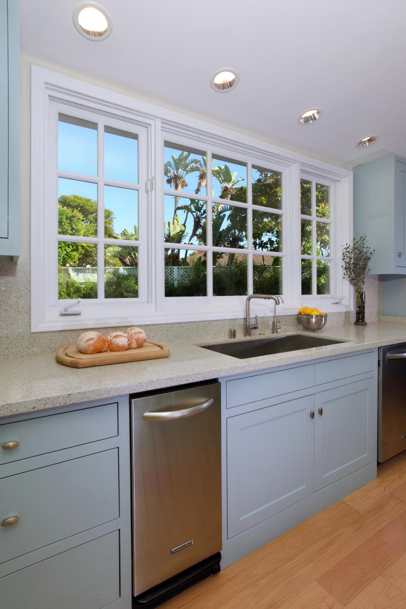 Stainless Steel Sink in Kitchen With Light Blue Cabinets