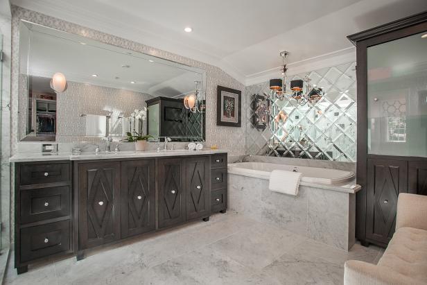 Art Deco Master Bathroom With Marble Accents and Dark Wood Vanity