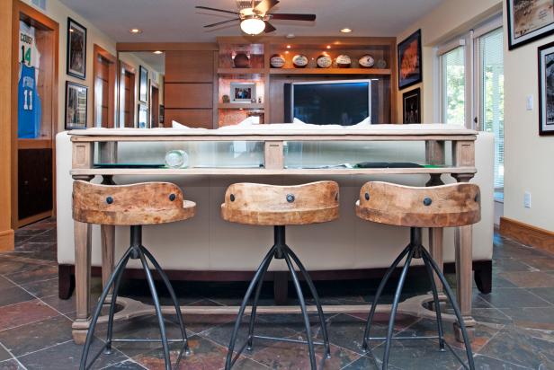 Eclectic Sports Room With Wooden Barstools