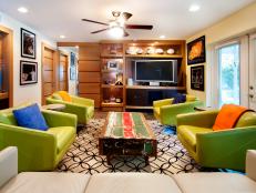 Eclectic Family Room With Sports Memorabilia and Green Chairs 