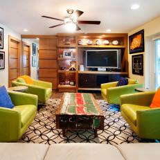 Sports Themed Basement With Comfy Seating Area