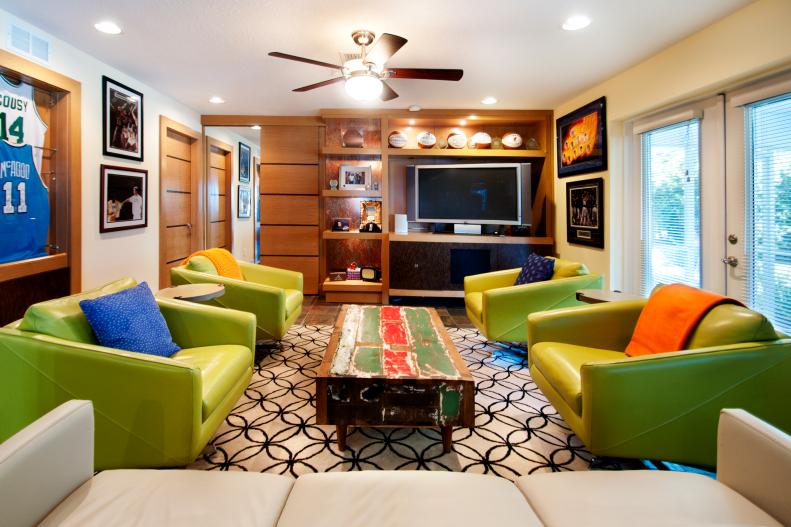 Eclectic Family Room With Sports Memorabilia and Green Chairs 