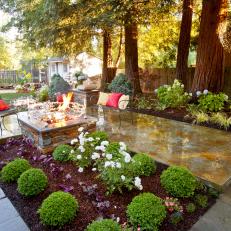Polished Concrete Patio With Lush Landscaping