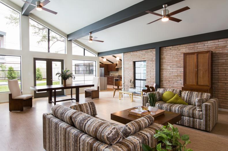 Open Living Space With Modern Vibe, High Ceiling & Exposed Brick Wall