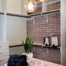 Updated Contemporary Closet With Exposed Brick Wall