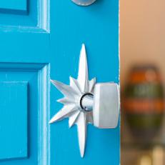 Bright Blue Front Door With Midcentury-Modern Doorknob