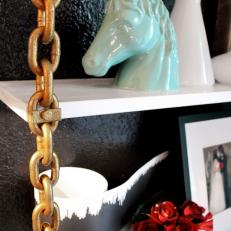 Eclectic Dining Room With Unicorn Sculpture on Bookshelf