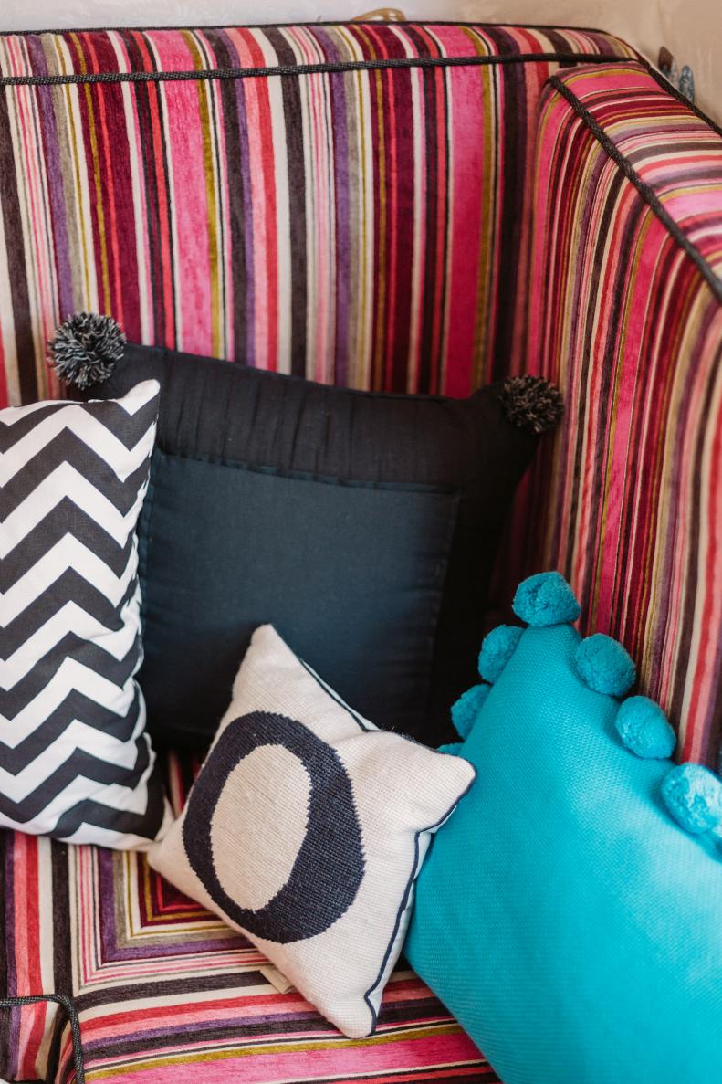 Chevron, Black and Turquoise Throw Pillows on Striped Cushion