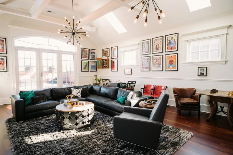 Eclectic Living Room With Black Sectional, Framed Posters
