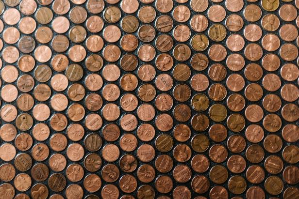Dozens of Pennies Glued to Black Background