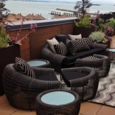 Contemporary Rug and Wicker Furniture on Rooftop Deck