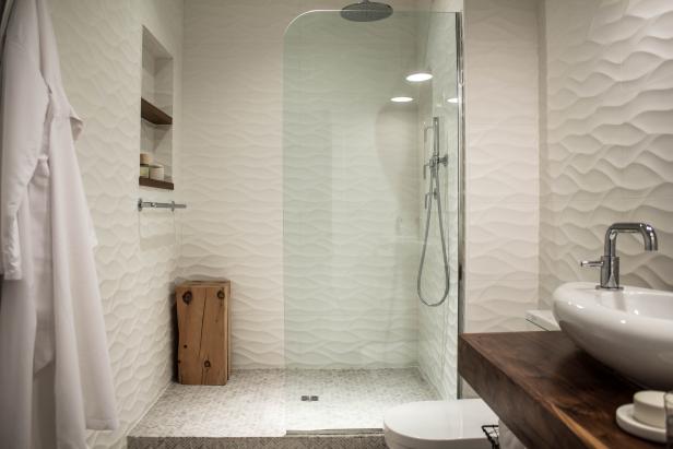White Modern Bathroom With Shower With Rippled Tile and Glass Wall
