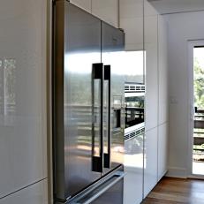 Stainless Refrigerator and Sleek Cabinets in Modern Kitchen