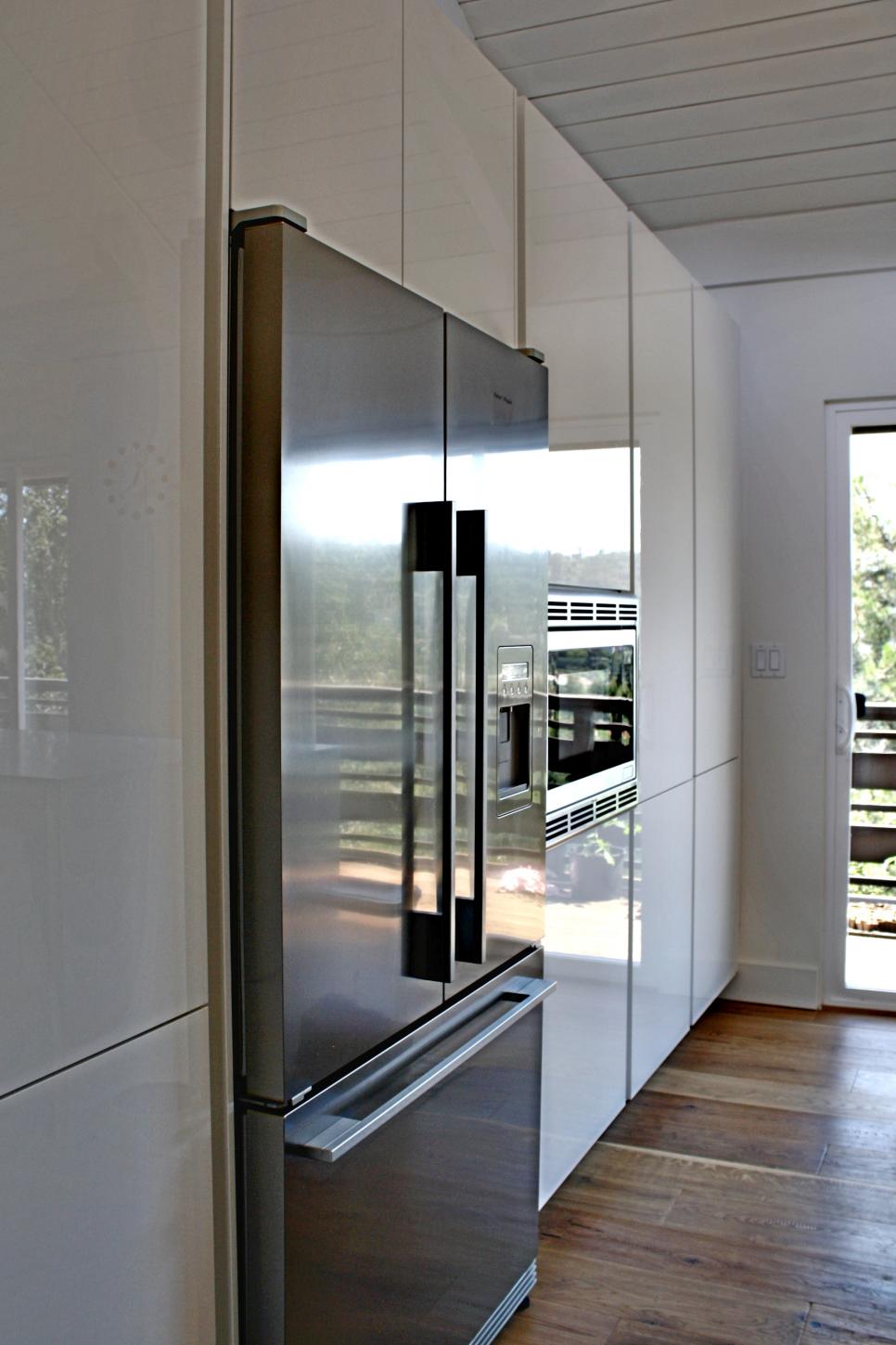 Stainless Refrigerator and Sleek Cabinets in Modern Kitchen | HGTV