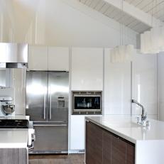 Stylish Kitchen With Sleek White Cabinetry and Island