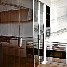 Sleek, Wood Pantry Doors in Modern Kitchen