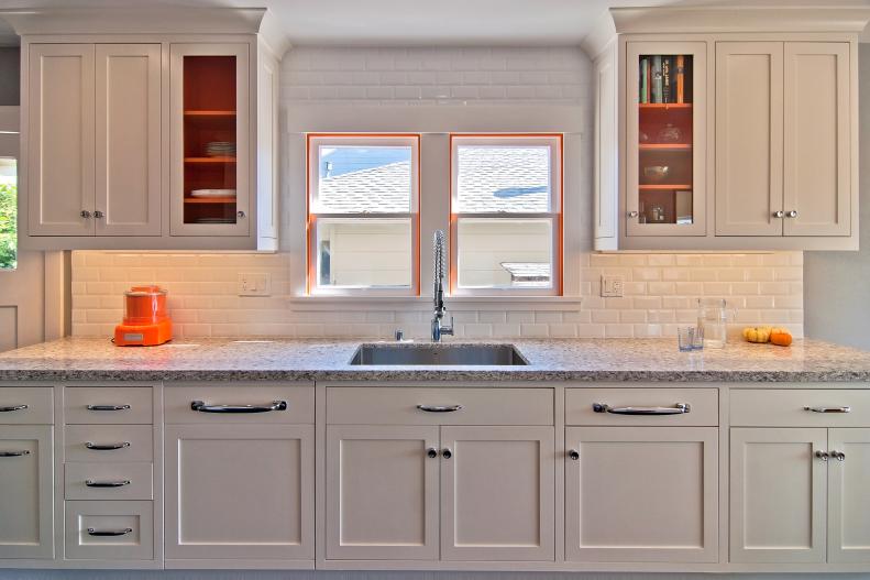 White Transitional Kitchen With Orange Accents
