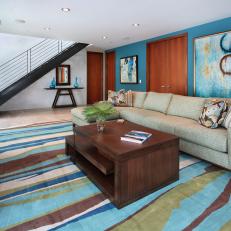 Living Room with Bold Rug and Blue Accent Wall