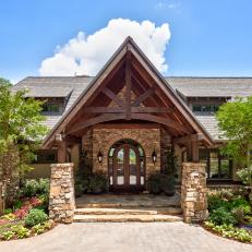 Rustic Mountain Retreat with Stone Exterior and Grand Entryway