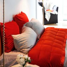 Red and Gray Bed Linens With Floor Lamps in White Bedroom