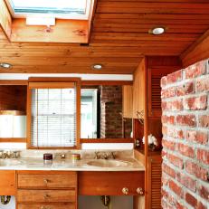 Bathroom with Wood Plank Ceiling and Exposed Brick