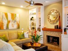 Yellow Family Room with Built-In Shelving and Fireplace