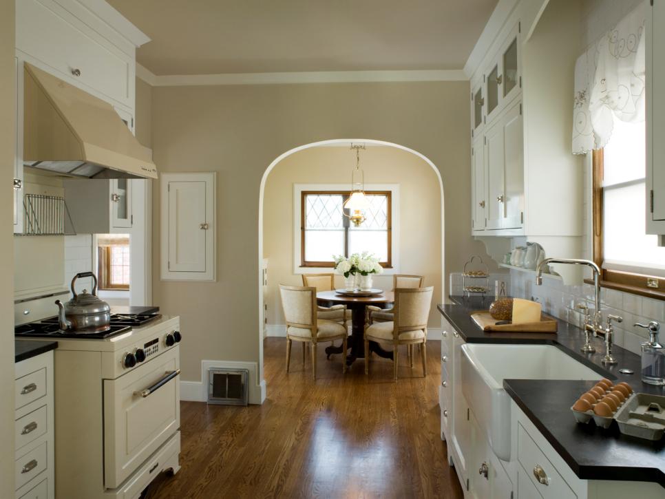 White Kitchen with Arched Doorway to Dining Room
