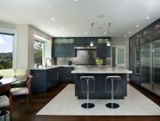 Modern Kitchen With Dark Teal Cabinets and Metal Backsplash