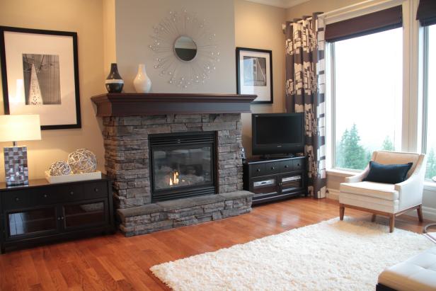 Neutral Living Room With Gray Stacked Stone Fireplace | HGTV