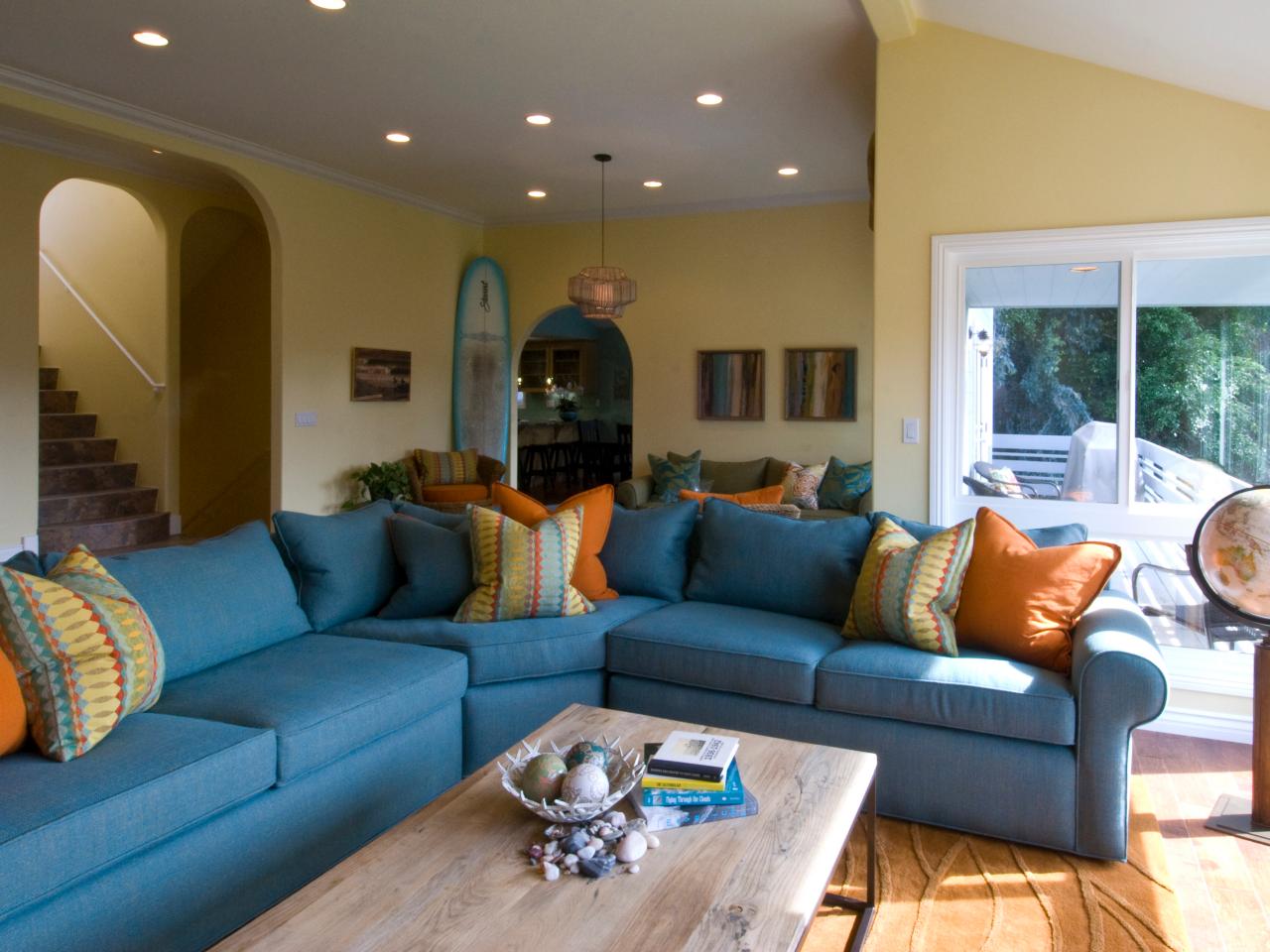 Blue Sectional Sofa in Coastal Yellow Family Room | HGTV