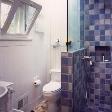 Cottage Bathroom With Hexagonal Floor Tile and Blue Shower