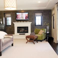 Contemporary Master Bedroom With Seating Nook and Fireplace