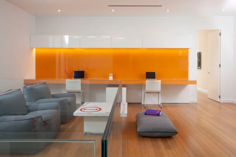 Minimalist living room with glass partitions within the room