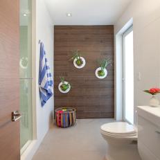 Neutral Coastal-Style Bathroom With Wood Accent Wall