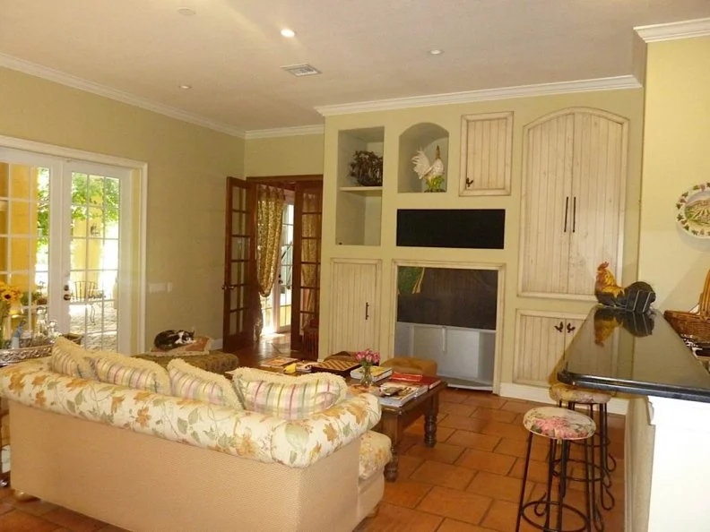 Homey but dated French Country-style family room