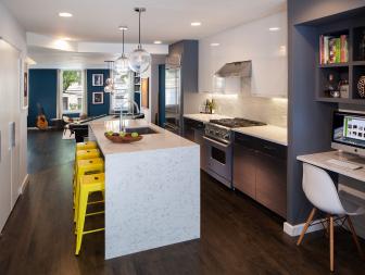 White Modern Kitchen With Marble Island, Desk and Yellow Barstools