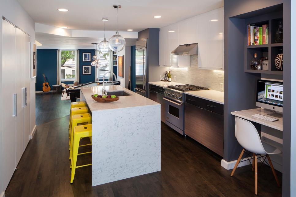 White Modern Kitchen With Marble Island, Desk and Yellow Barstools