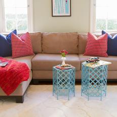Red and Navy Pillows on Taupe Sectional in Transitional Space
