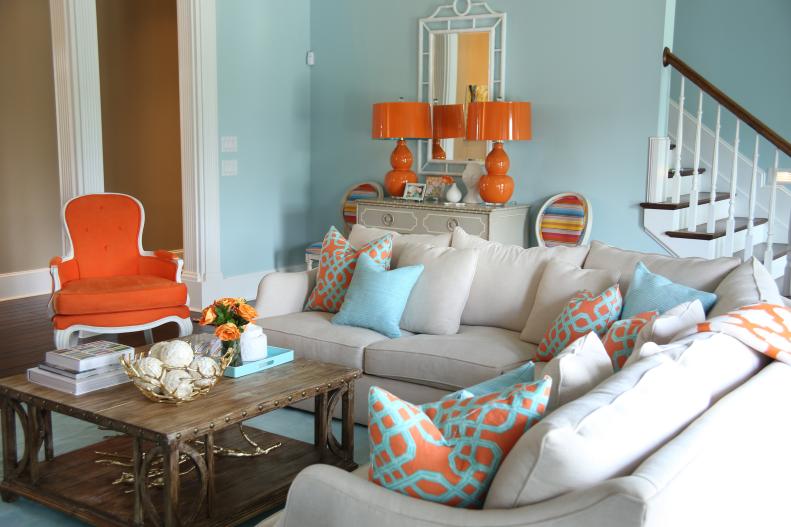 Blue Transitional Living Room With Beige Sectional and Orange Chair