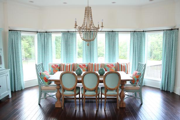 Neutral Coastal Dining Room With Aqua Curtains and Dining Chairs
