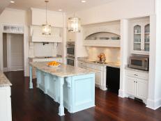 Cottage Kitchen With White Cabinets and Aqua Island
