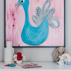 Pink and Blue Peacock Artwork Adorns Nursery Wall