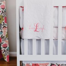 Monogrammed Blanket Adorns White Crib in Girl's Nursery